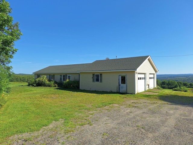 ranch-style house with a front lawn and a garage