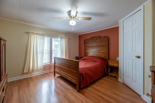 bedroom with light wood finished floors, ceiling fan, baseboards, and ornamental molding