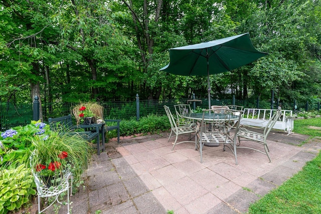 view of patio / terrace with outdoor dining space and fence