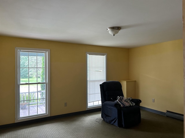 unfurnished room featuring carpet, baseboards, and baseboard heating