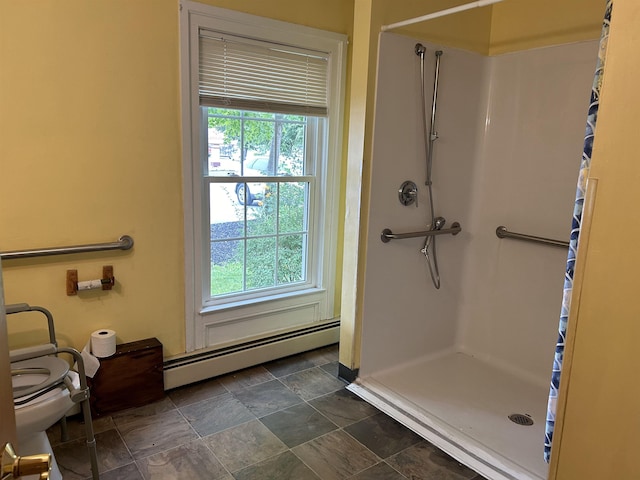 full bathroom with baseboard heating, a healthy amount of sunlight, toilet, and a shower stall