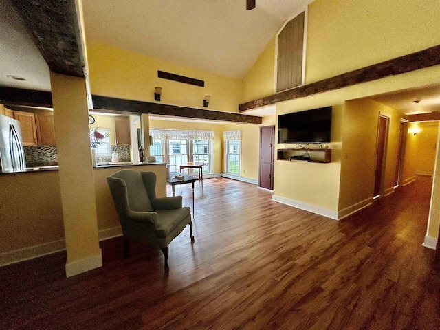 living area with baseboards, high vaulted ceiling, and dark wood finished floors