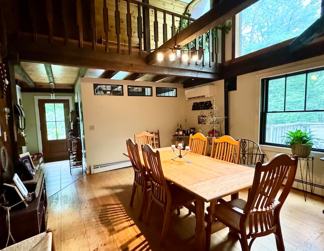 dining area featuring a baseboard radiator, high vaulted ceiling, a wall mounted AC, and beam ceiling