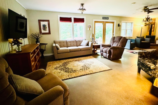 living room featuring french doors and ceiling fan