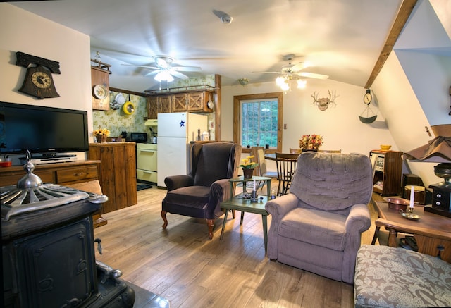 living room featuring hardwood / wood-style floors and ceiling fan