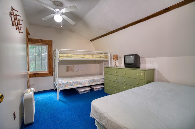 carpeted bedroom featuring ceiling fan and lofted ceiling