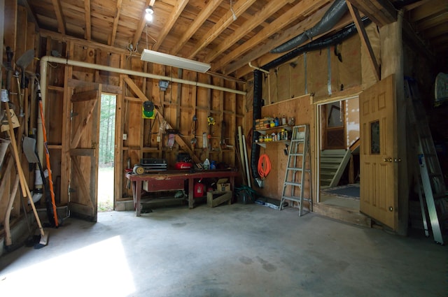 garage with a workshop area