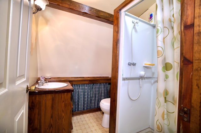 bathroom with tile patterned floors, vanity, and toilet