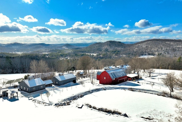 snowy aerial view with a mountain view