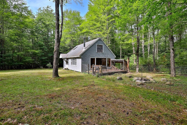 400 Ruusunen Rd, Springfield, VT 05156 - back of house with a lawn, a view of trees, fence, and a wooden deck