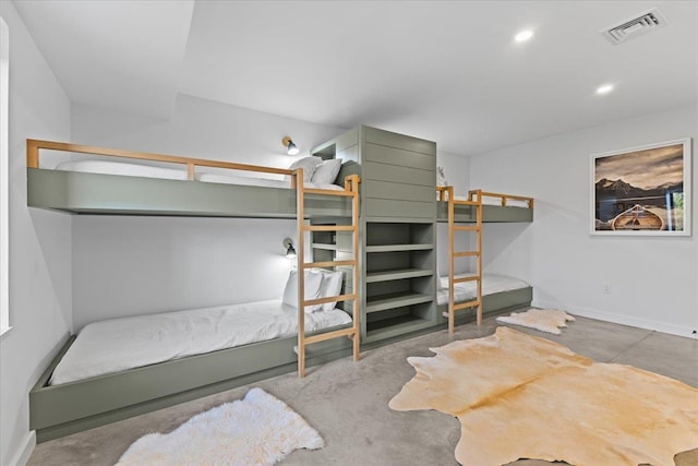 bedroom featuring recessed lighting, baseboards, visible vents, and concrete flooring