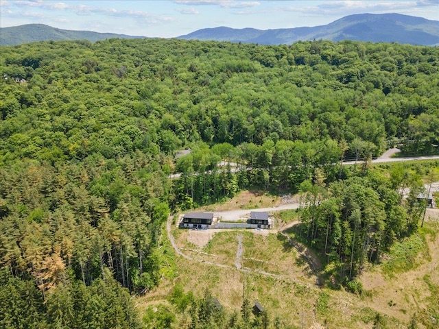 bird's eye view featuring a forest view and a mountain view