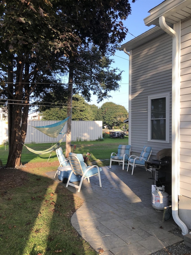 view of patio featuring fence