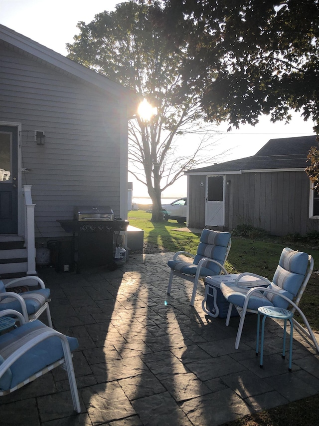 view of patio featuring grilling area and an outbuilding