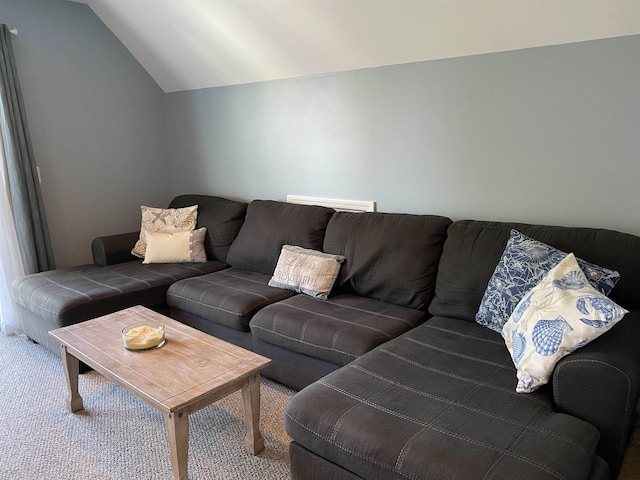 carpeted living room featuring vaulted ceiling