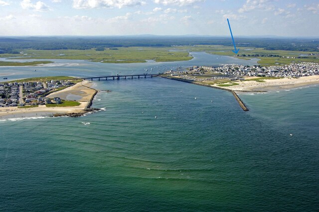 bird's eye view featuring a beach view and a water view