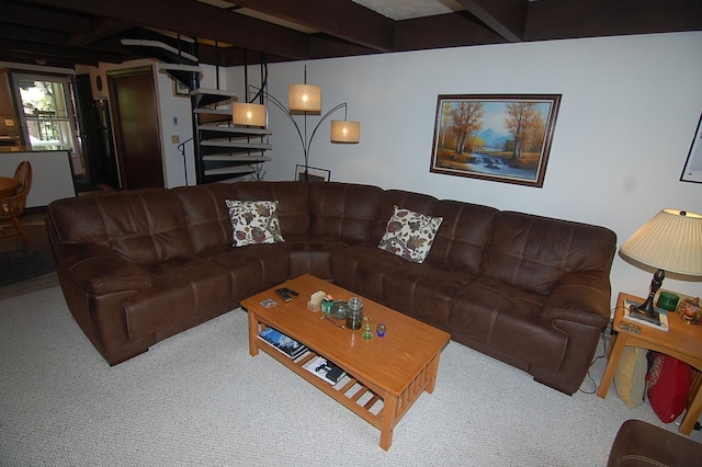 living room with carpet flooring and beamed ceiling