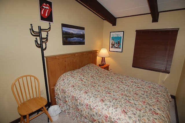 carpeted bedroom featuring beamed ceiling