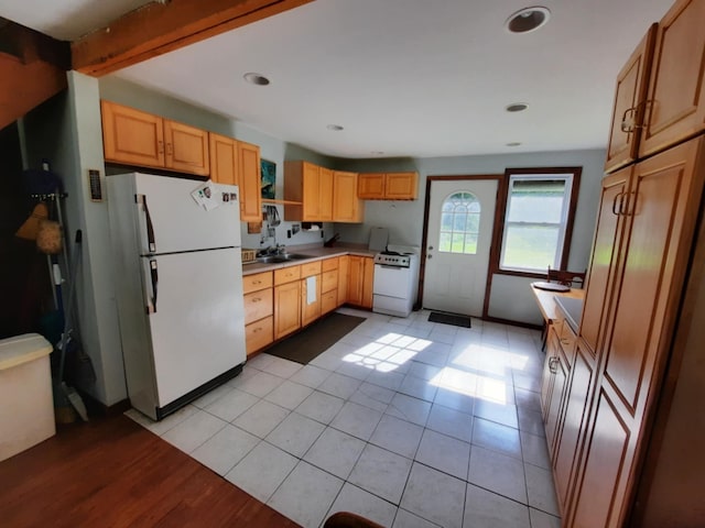 kitchen featuring recessed lighting, white appliances, a sink, light countertops, and beamed ceiling