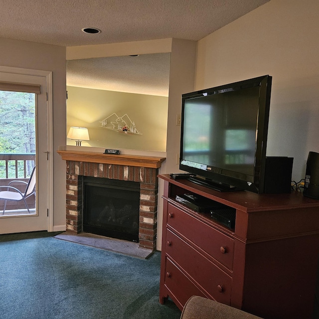 living area with carpet floors, a fireplace, and a textured ceiling