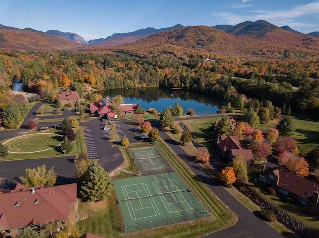 aerial view featuring a water and mountain view