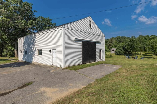 garage with a lawn