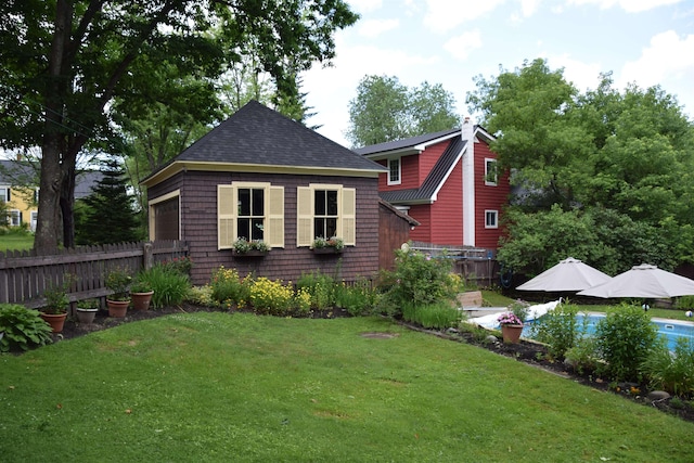 back of property featuring a lawn