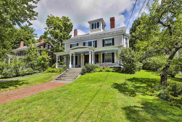 view of front of house featuring a front lawn and a porch