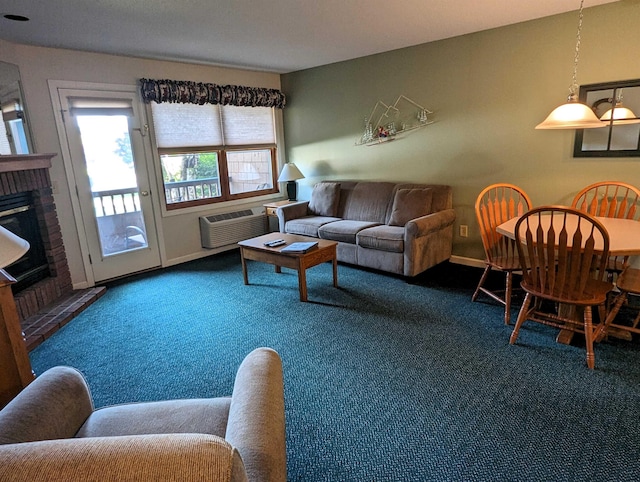 carpeted living area featuring a fireplace, baseboards, and an AC wall unit