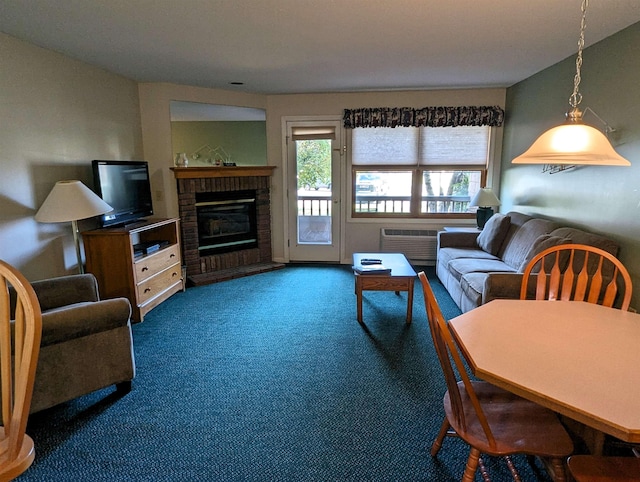 living room featuring a brick fireplace, carpet flooring, and a wall mounted AC