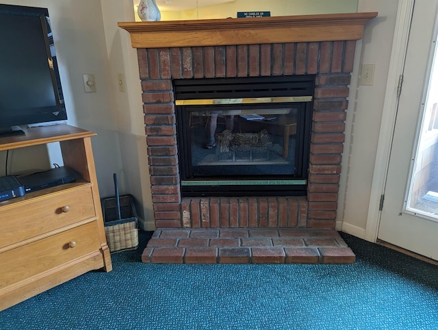 room details featuring a brick fireplace and baseboards