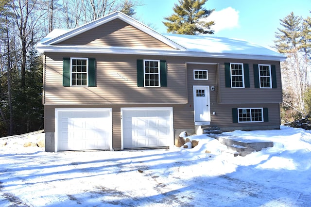 bi-level home featuring a garage