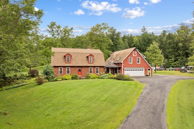 cape cod house with a front lawn and a garage