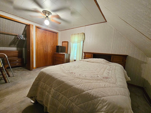 bedroom featuring vaulted ceiling, ceiling fan, and carpet flooring