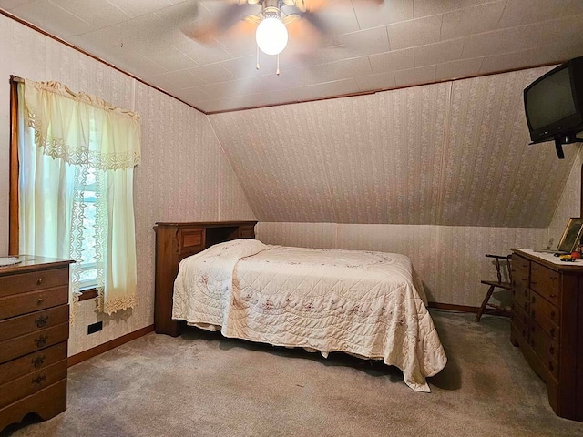 bedroom with carpet floors, vaulted ceiling, and ceiling fan