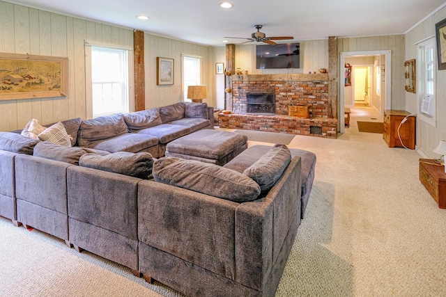 living room featuring recessed lighting, a brick fireplace, carpet flooring, and ceiling fan