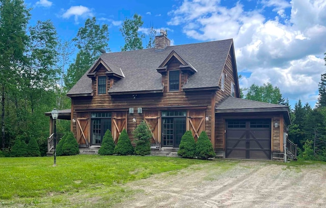 view of front facade with a front yard and a garage