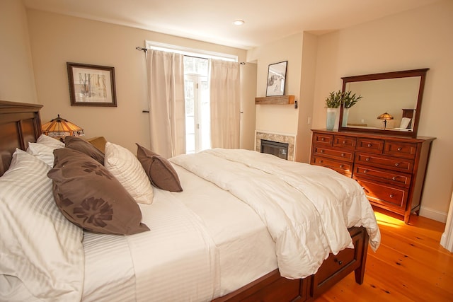 bedroom with light wood-type flooring