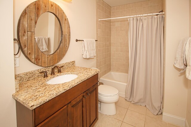 full bathroom with tile patterned floors, vanity, shower / bath combination with curtain, and toilet