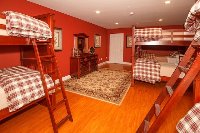 bedroom with hardwood / wood-style flooring