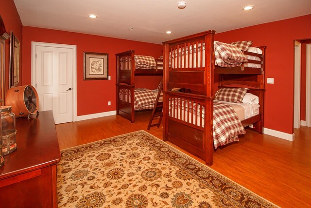 bedroom with hardwood / wood-style floors