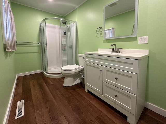 10 Hawthorne St, Plymouth, NH 03264 - full bathroom with wood finished floors, toilet, a stall shower, vanity, and ornamental molding