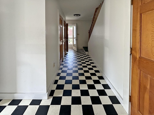 10 Hawthorne St, Plymouth, NH 03264 - hallway with tile patterned floors, baseboards, and stairs