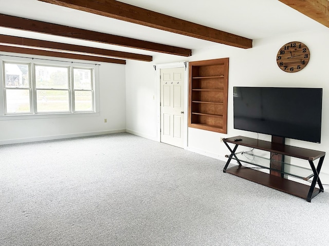 10 Hawthorne St, Plymouth, NH 03264 - unfurnished living room with baseboards, carpet, beam ceiling, and built in features