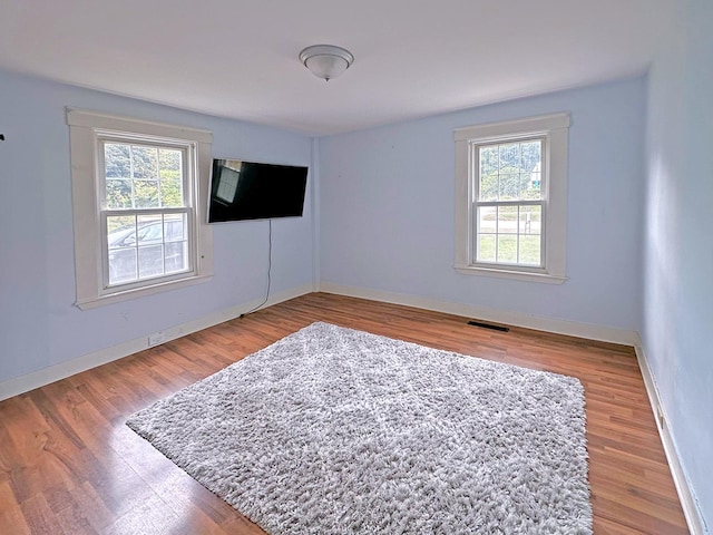 10 Hawthorne St, Plymouth, NH 03264 - unfurnished room with wood finished floors and baseboards