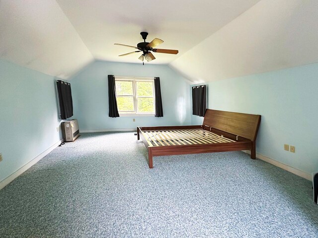 unfurnished bedroom featuring lofted ceiling, ceiling fan, and carpet floors