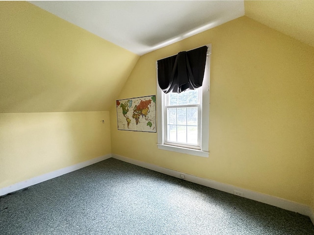 10 Hawthorne St, Plymouth, NH 03264 - additional living space featuring vaulted ceiling, carpet flooring, and baseboards