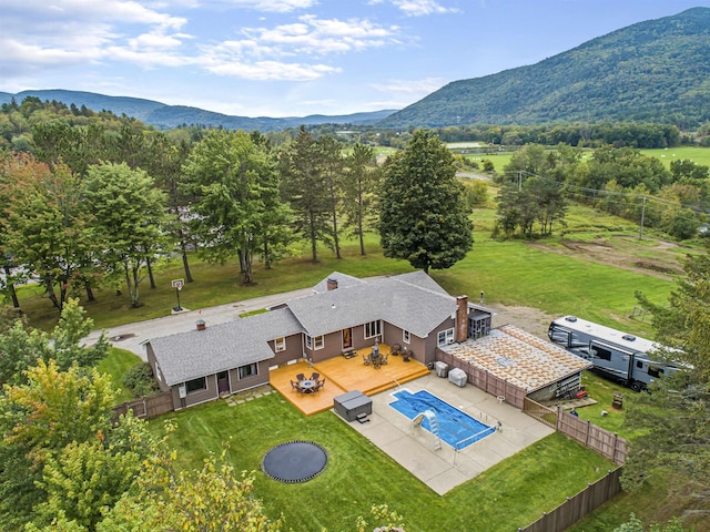 birds eye view of property featuring a mountain view