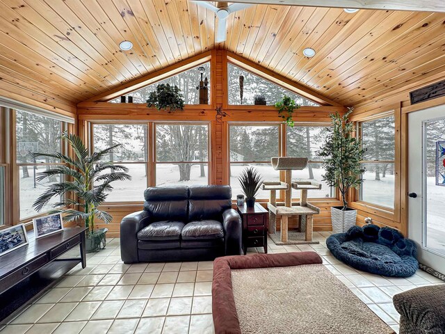 living room featuring ceiling fan, wood-type flooring, and a wealth of natural light