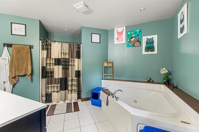 bathroom featuring vanity, independent shower and bath, and tile patterned flooring